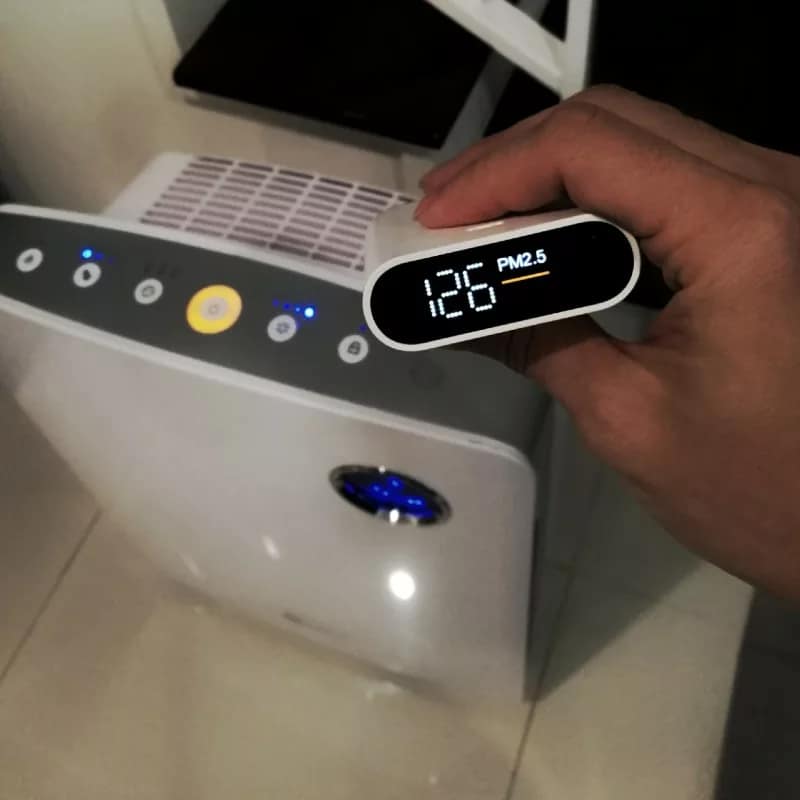 Professional Air Quality Inspection Technicians Air Quality Testing Thumbnail - The Air Quality Specialist Testing the Air with a Modern Technology Sensor